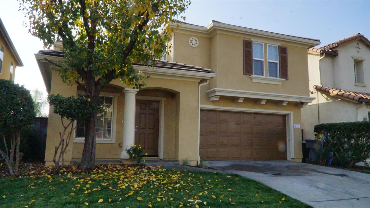 front view of a house with a small yard