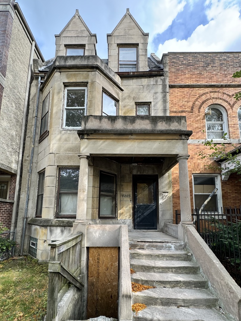 a front view of a house with garage