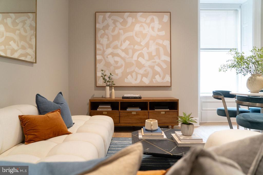 a living room with furniture and a large window