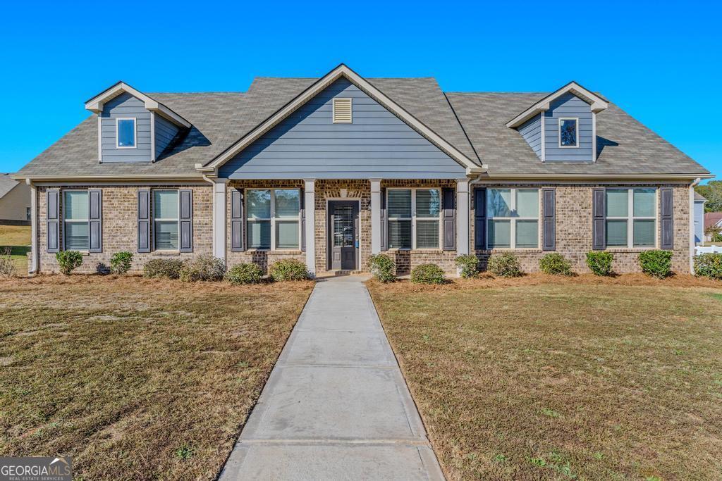 front view of a house with a yard