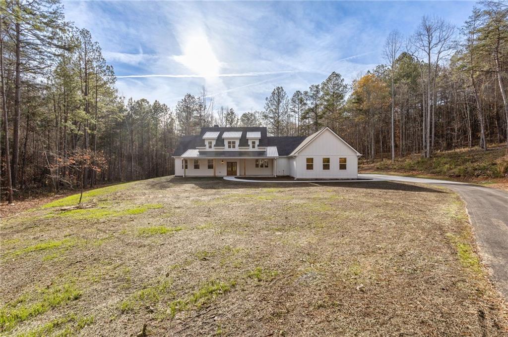 a house view with a wooden fence