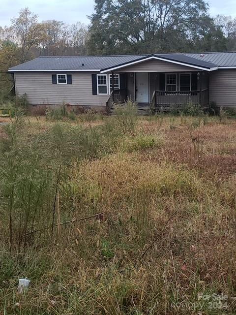 a front view of a house with yard