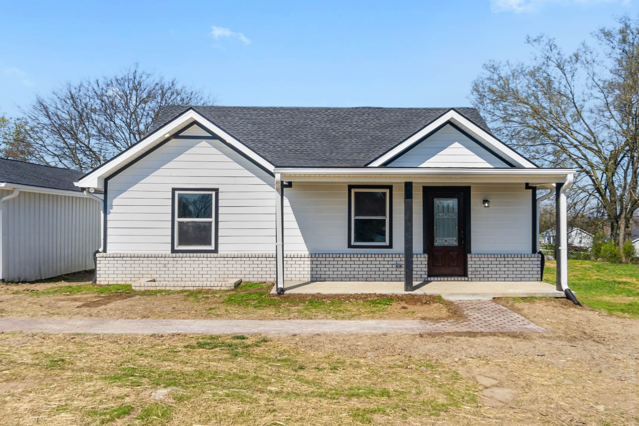 a front view of a house with a yard