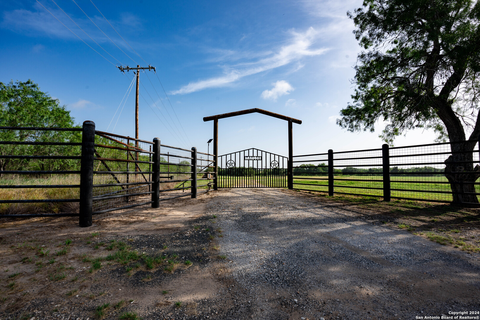 a view of a backyard with a fence