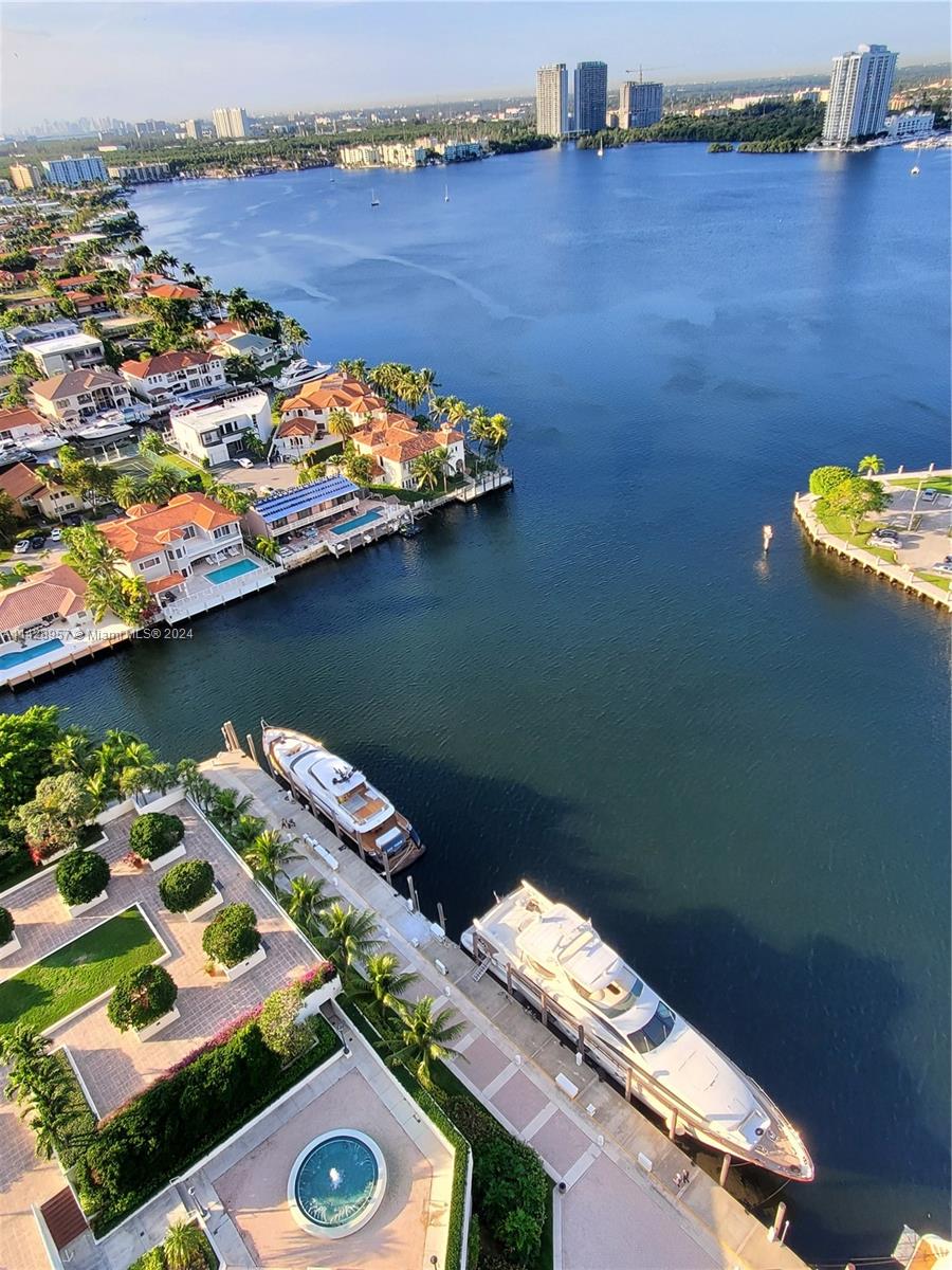 an aerial view of a house with a lake view