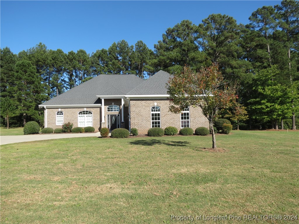 a house that has a big yard and large trees