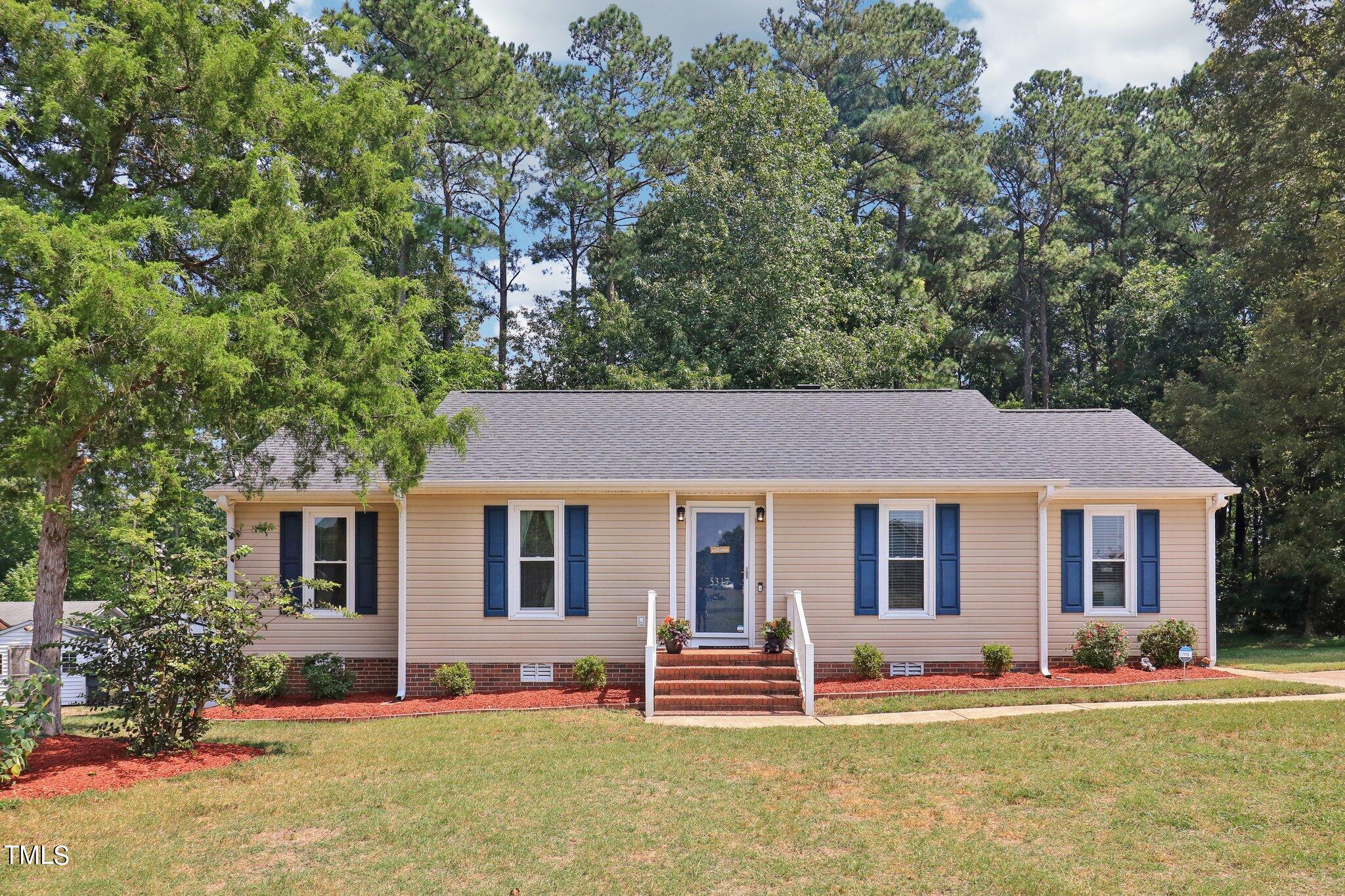 front view of a house with a yard