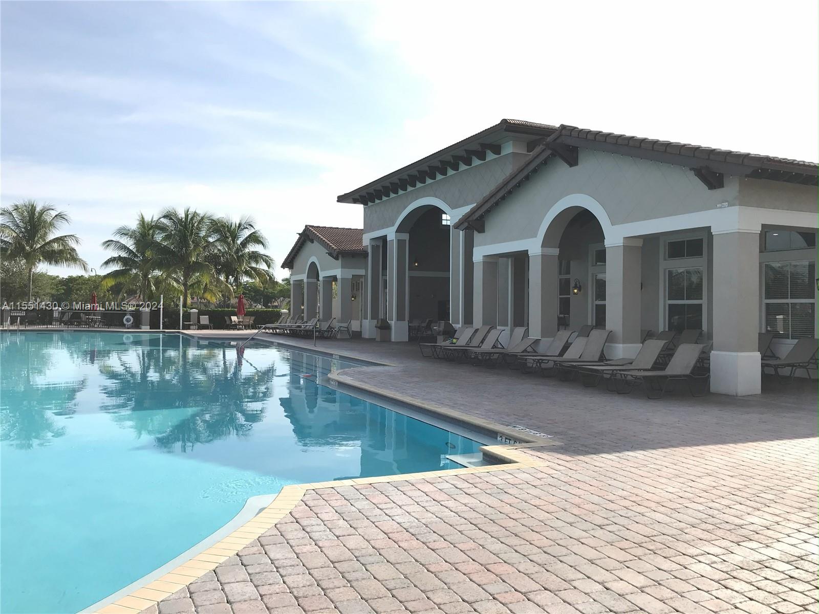 a view of a house with pool and lake view