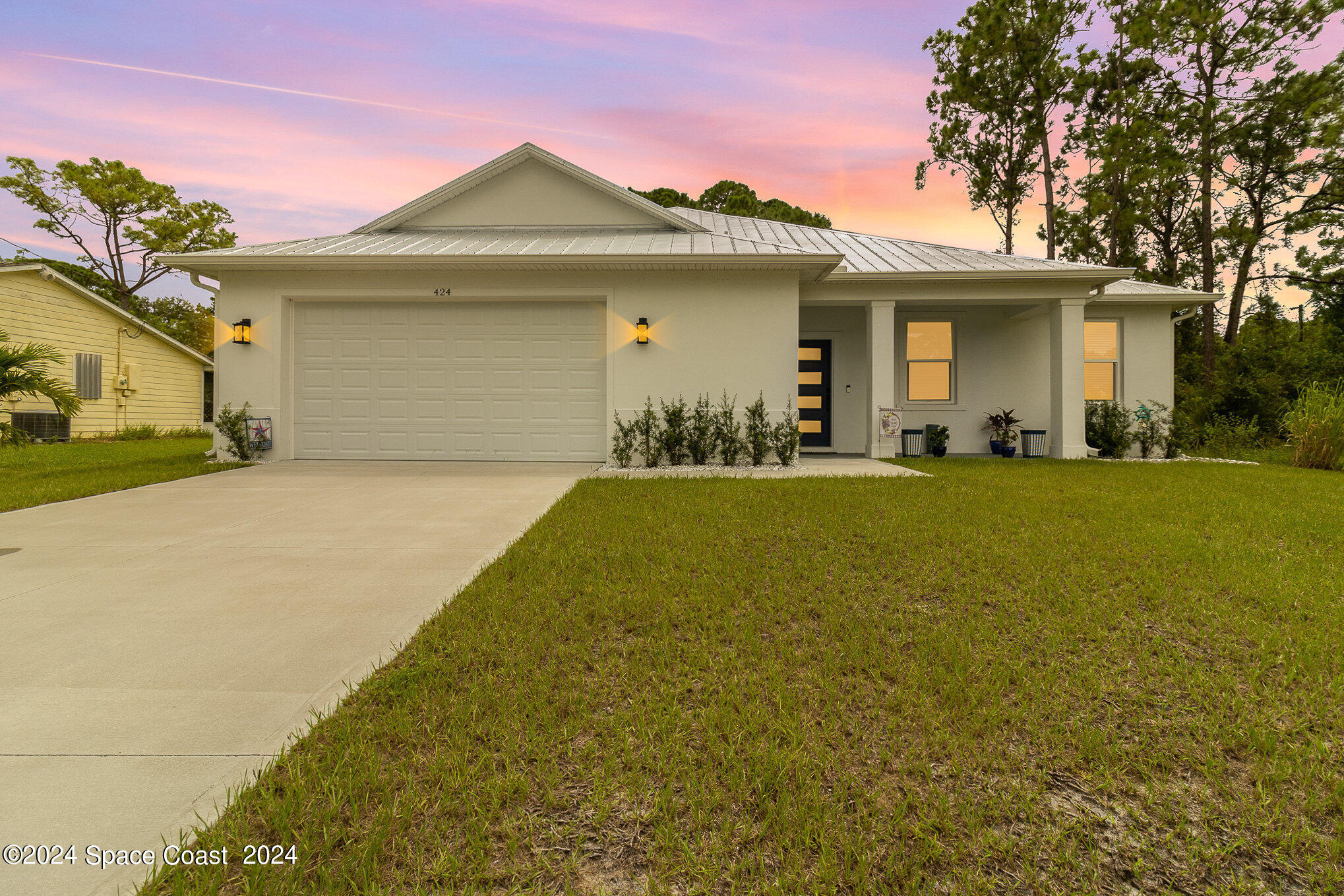 a front view of a house with a yard