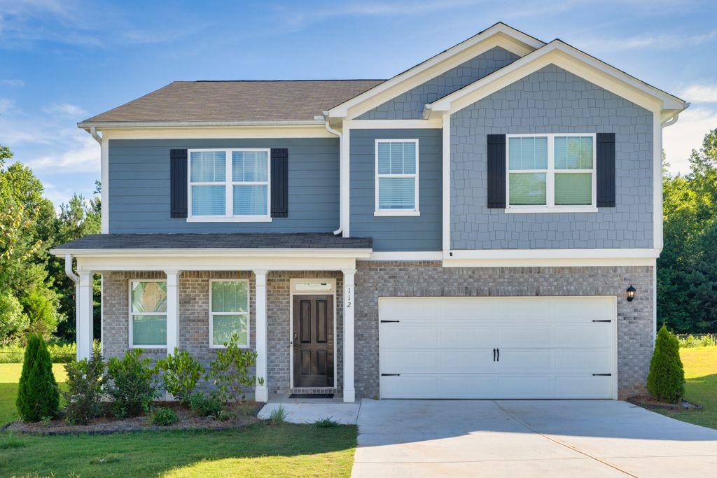 front view of house with a yard