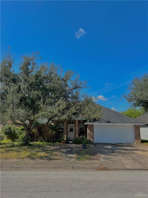 View of front of property with a garage