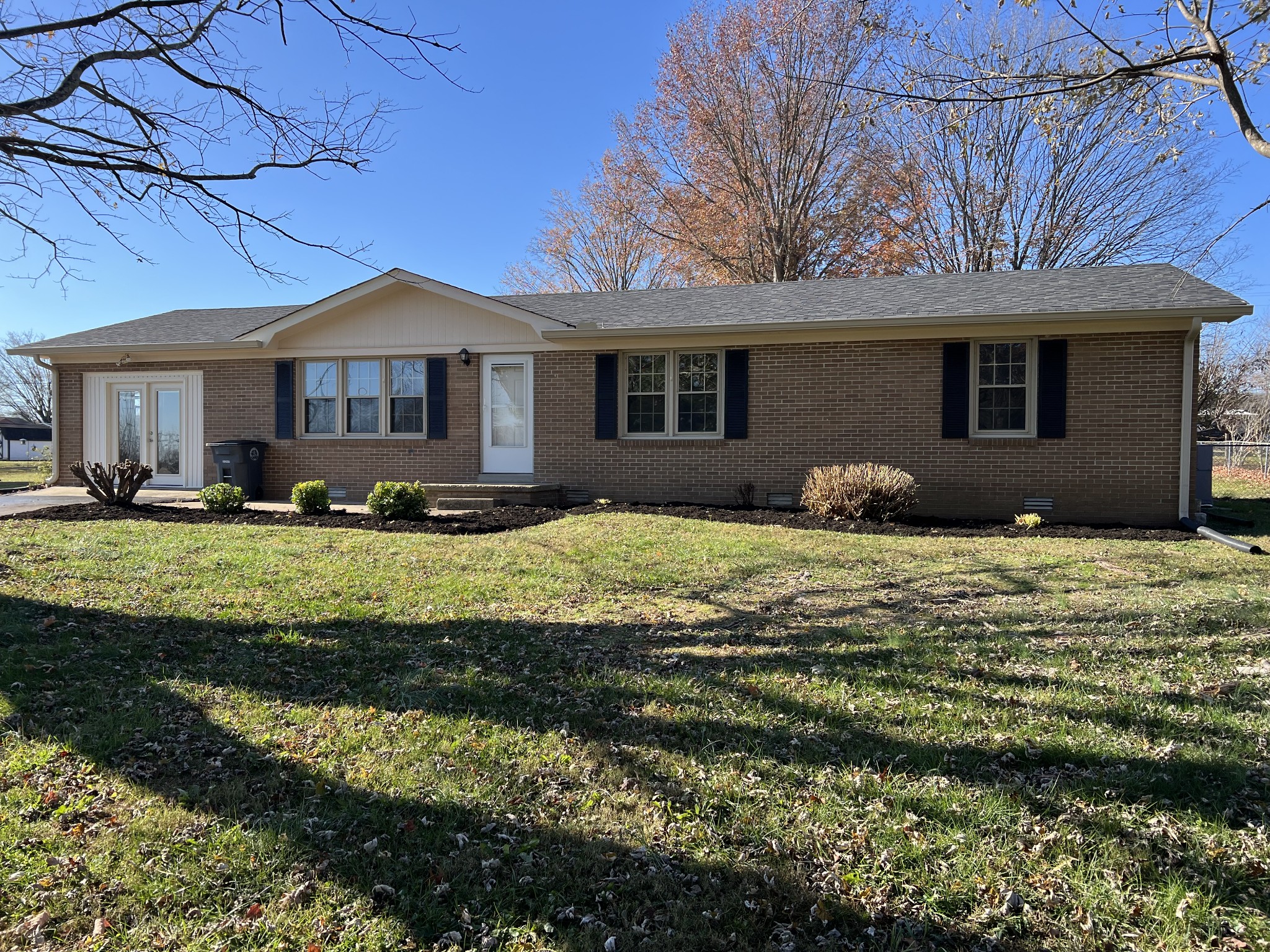 a front view of a house with a yard