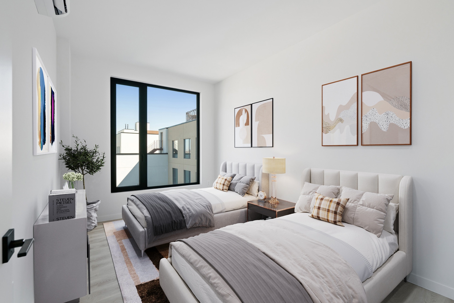 a bedroom with two beds and a potted plant