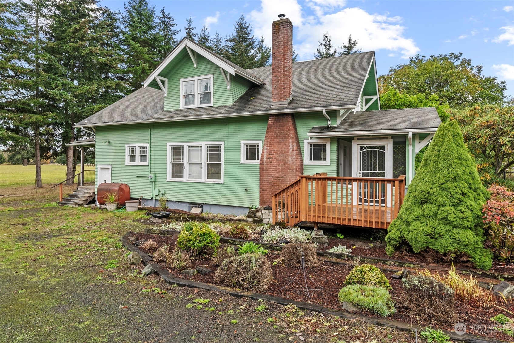 a front view of a house with garden