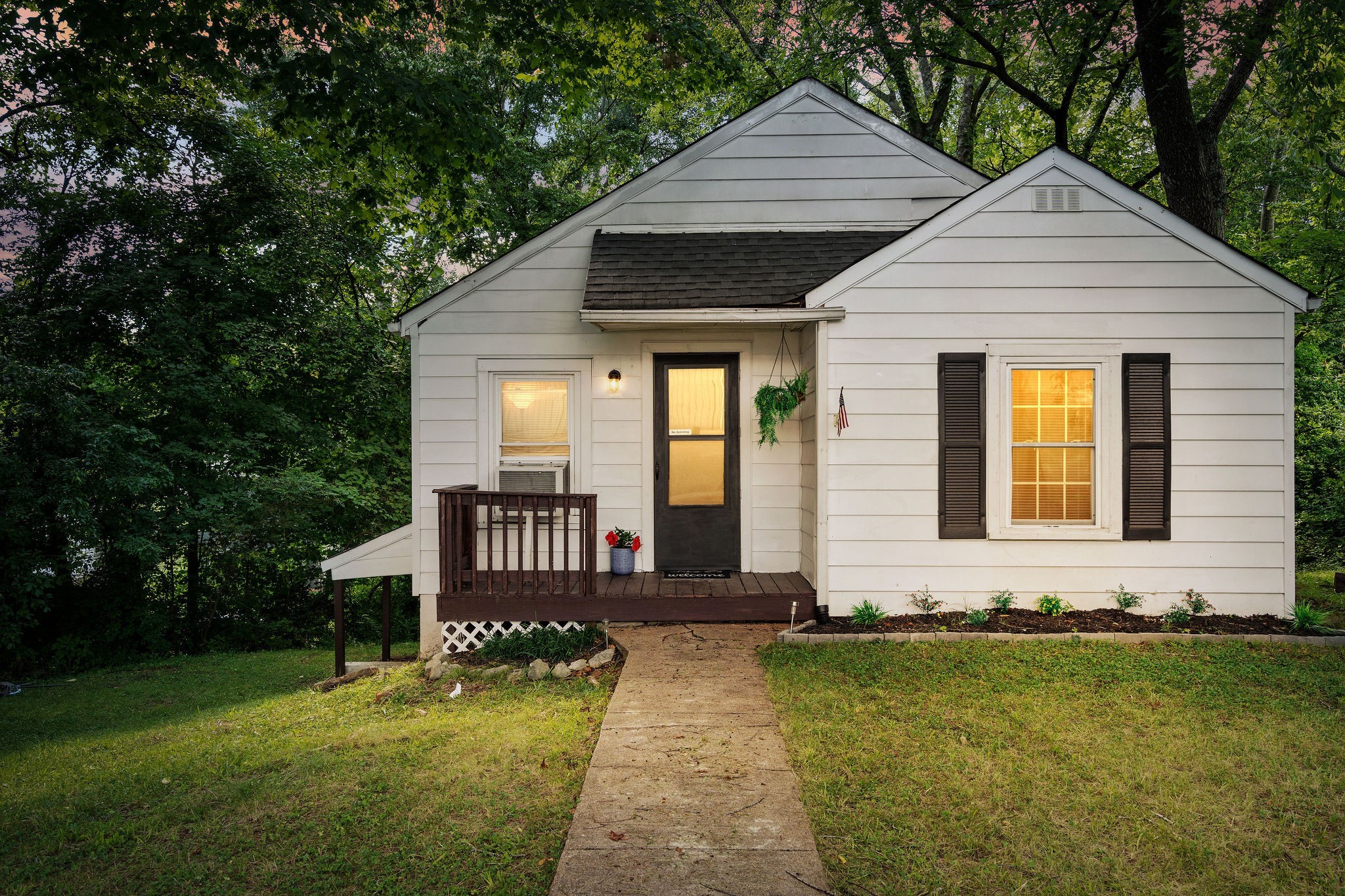 a front view of a house with a yard