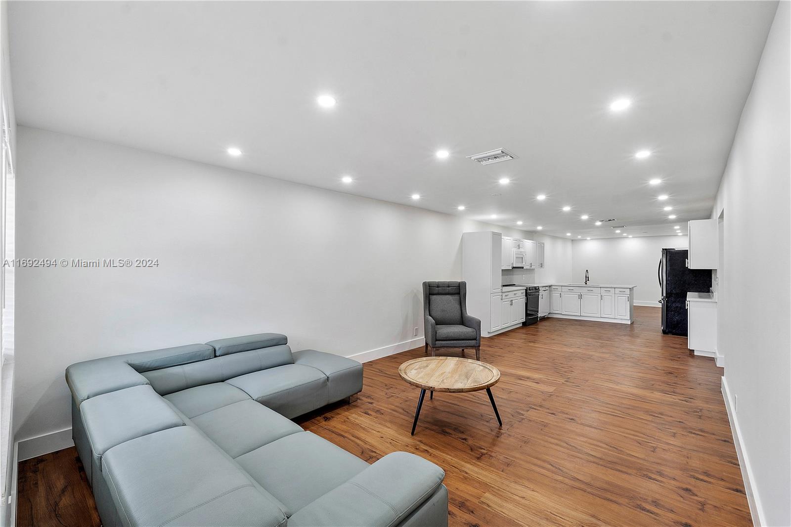 a living room with furniture and a table