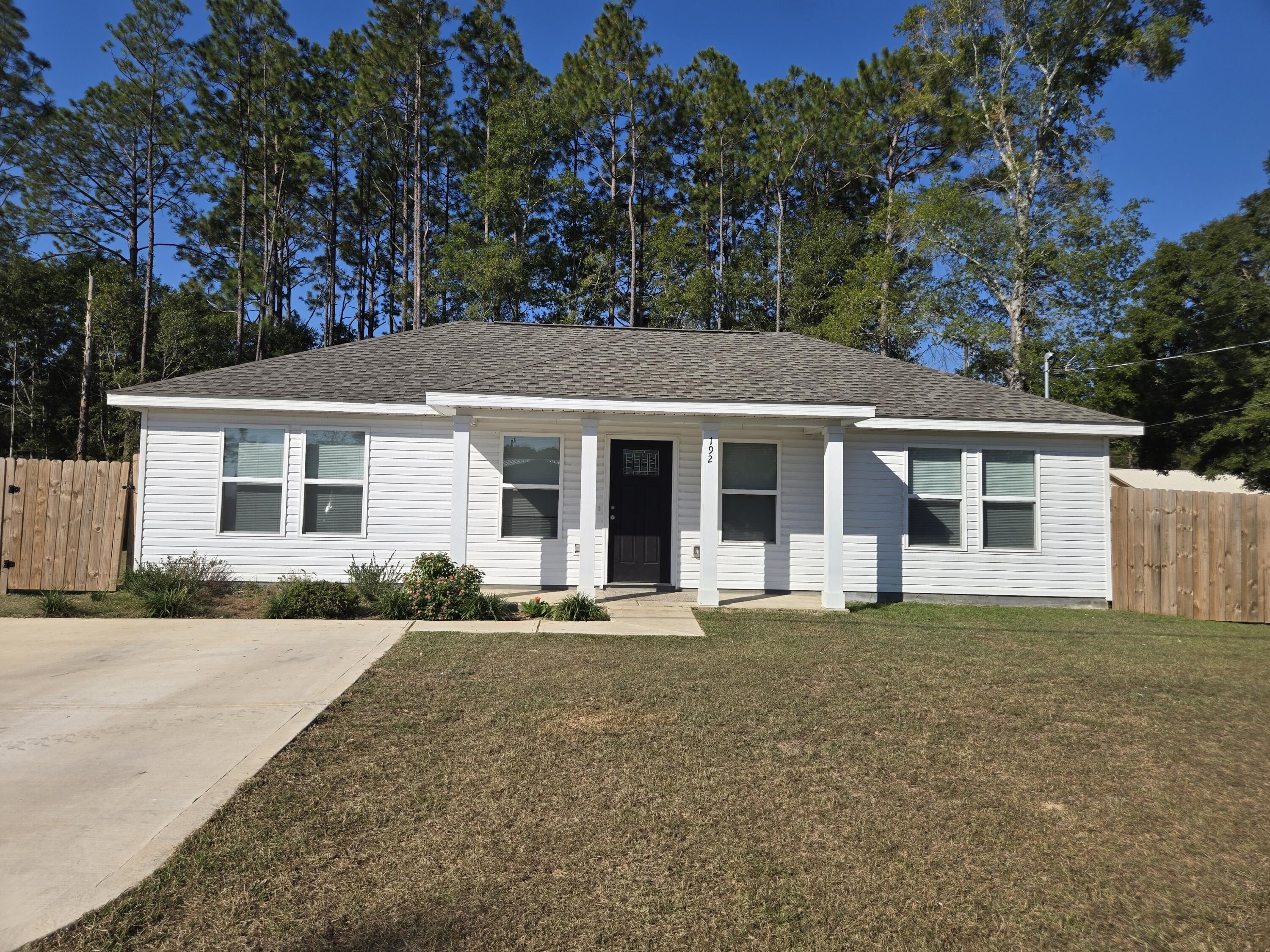 front view of a house with a garden