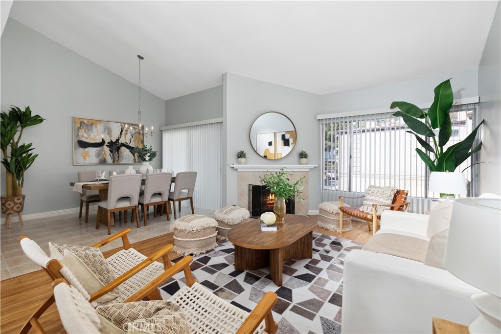 a living room with furniture a clock and a large window