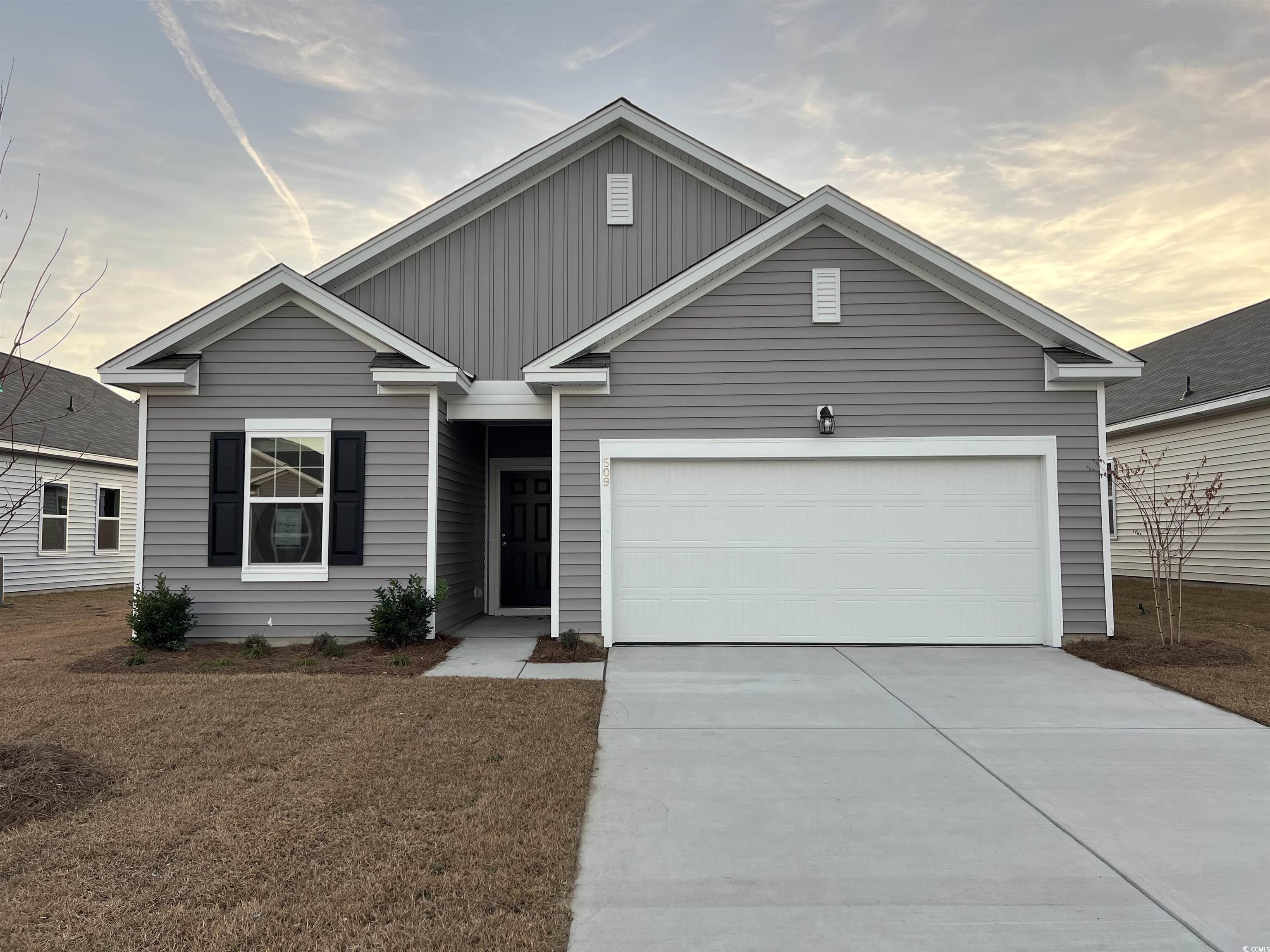 View of front facade with a garage