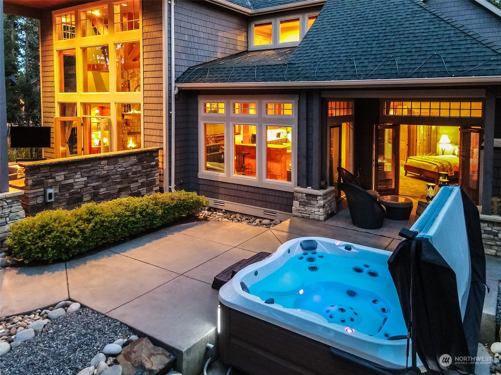 a backyard of a house with barbeque oven table and chairs