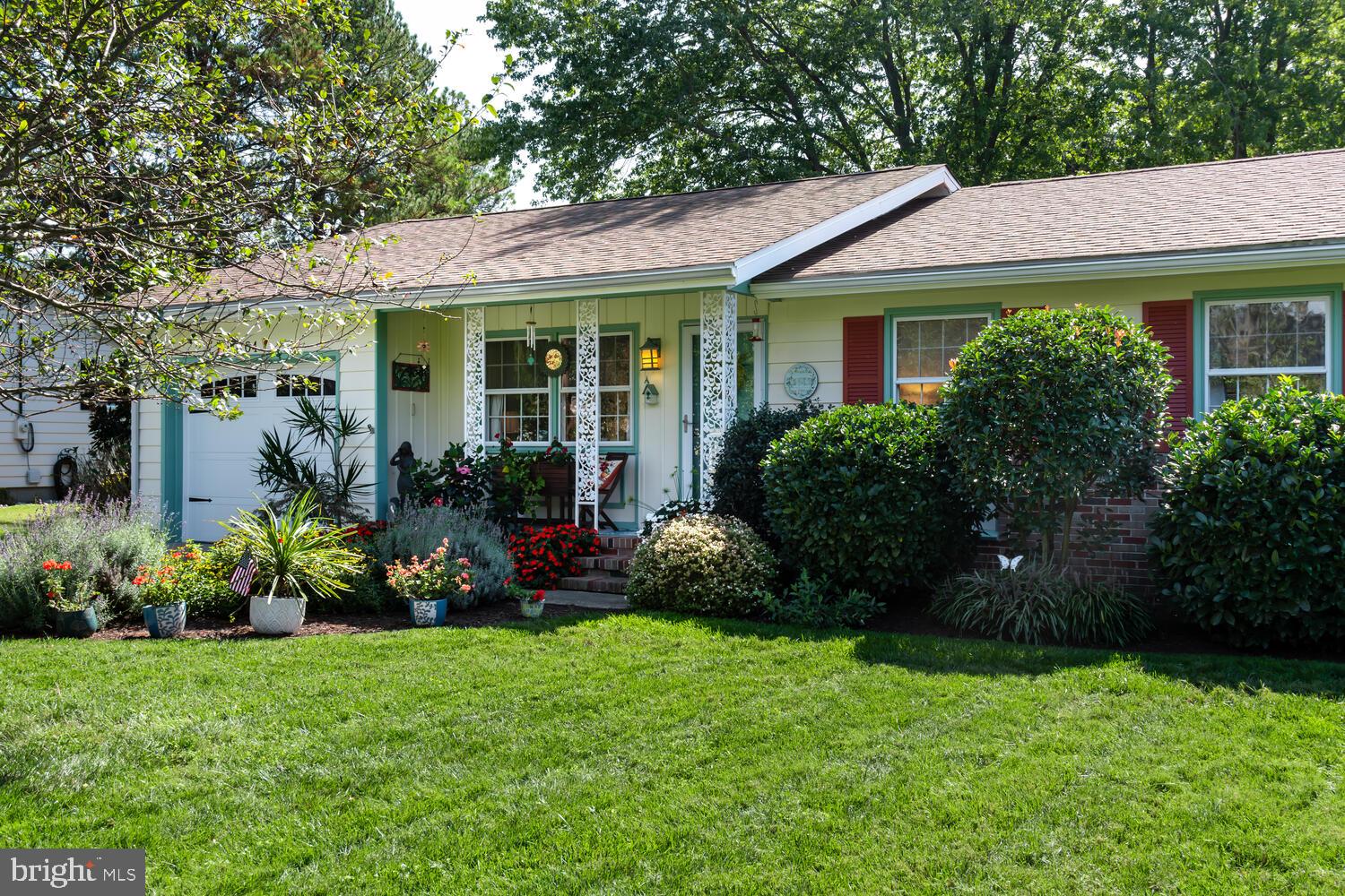 a view of a house with garden and plants