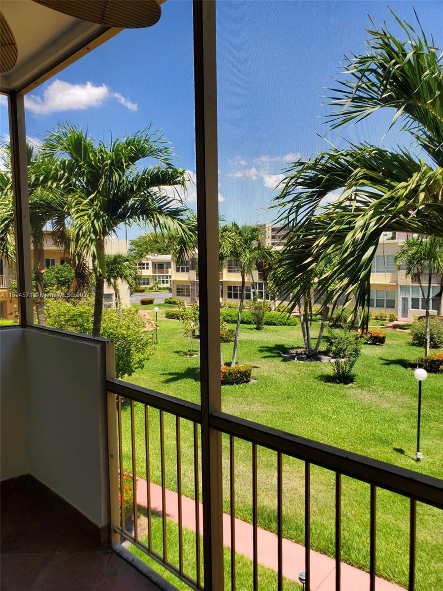 a view of swimming pool from a balcony