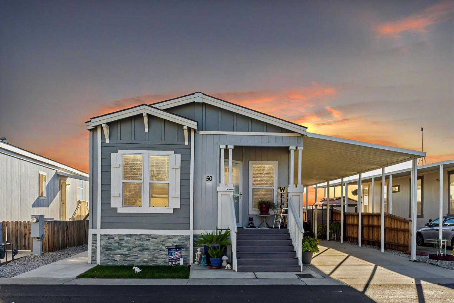 a front view of a house with glass windows and door