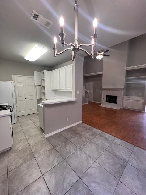 a view of a kitchen with a sink and a refrigerator