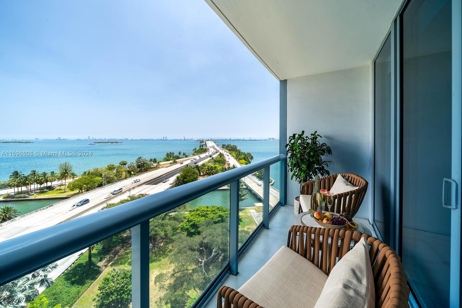 a view of a balcony with furniture