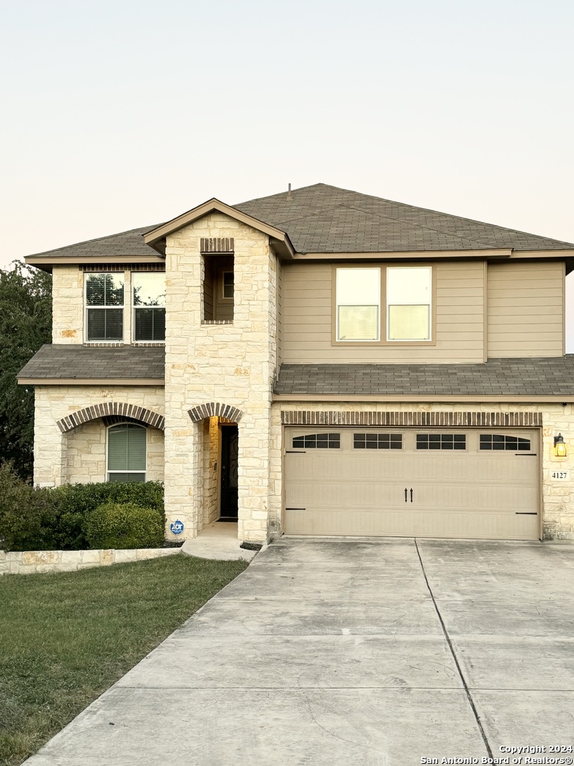 a view of a building with a yard