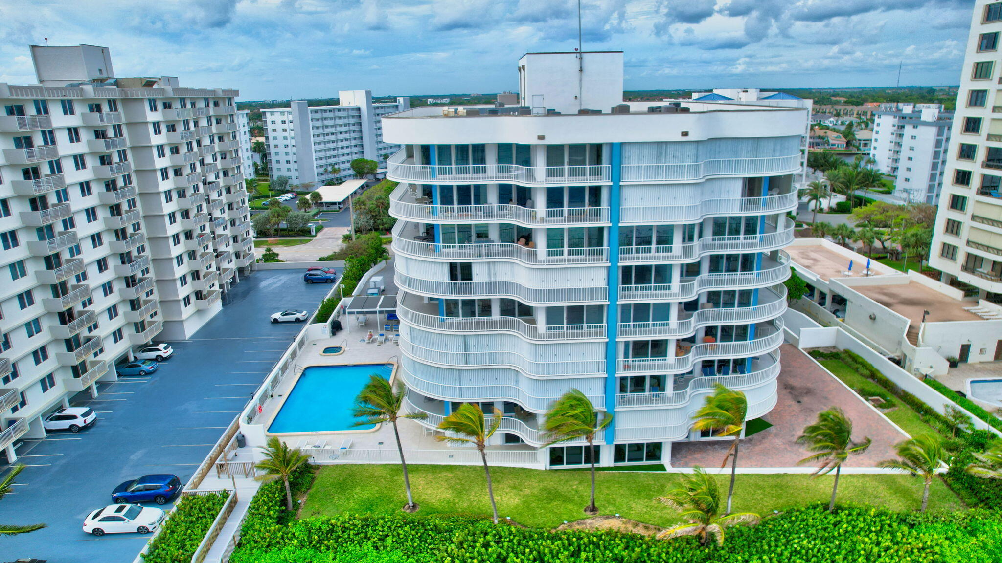 a aerial view of building with yard