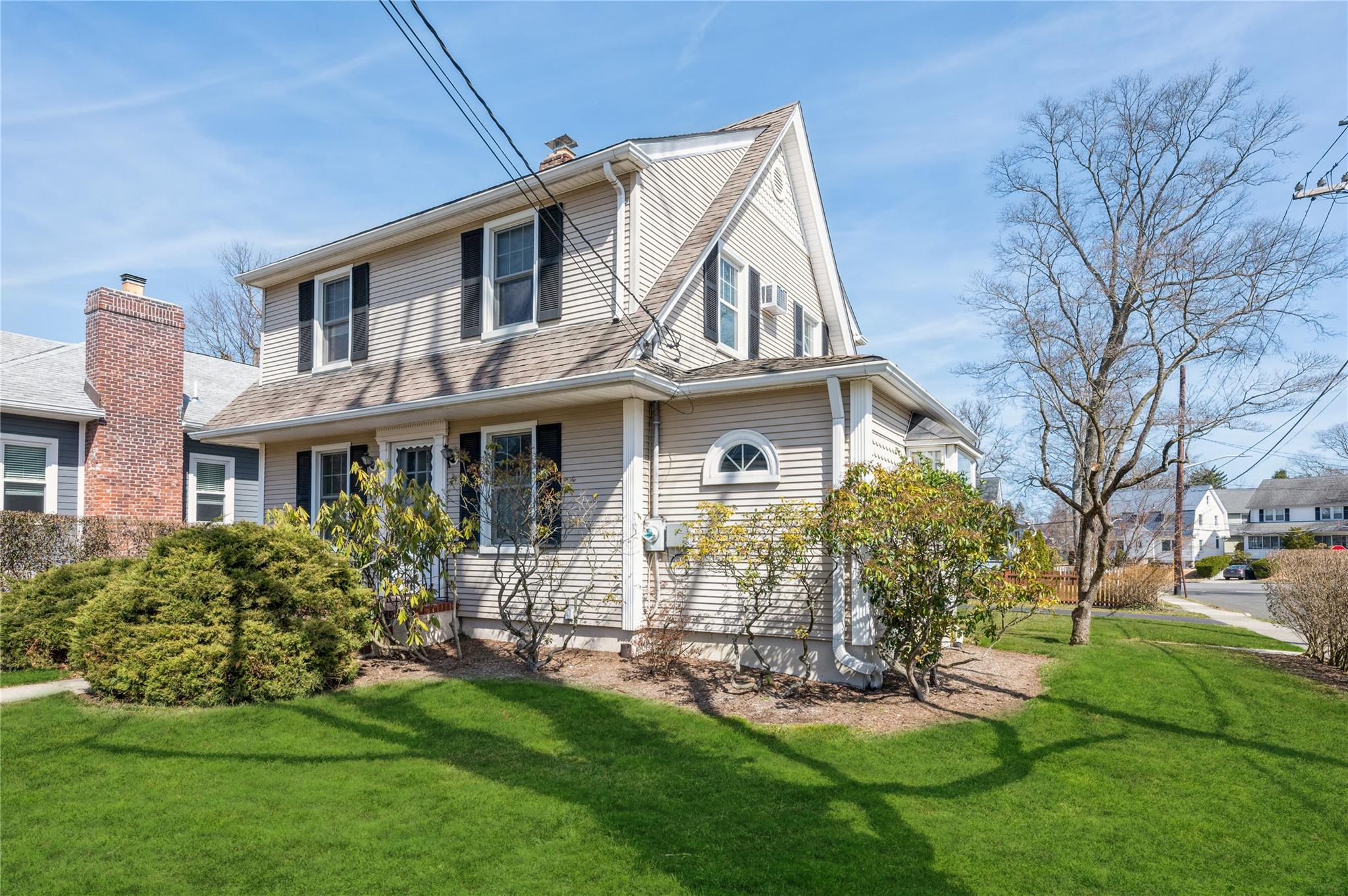 a view of a house with a yard porch and sitting area