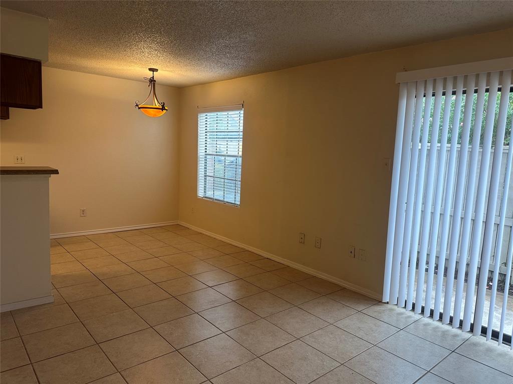 a view of livingroom with an empty space and a window