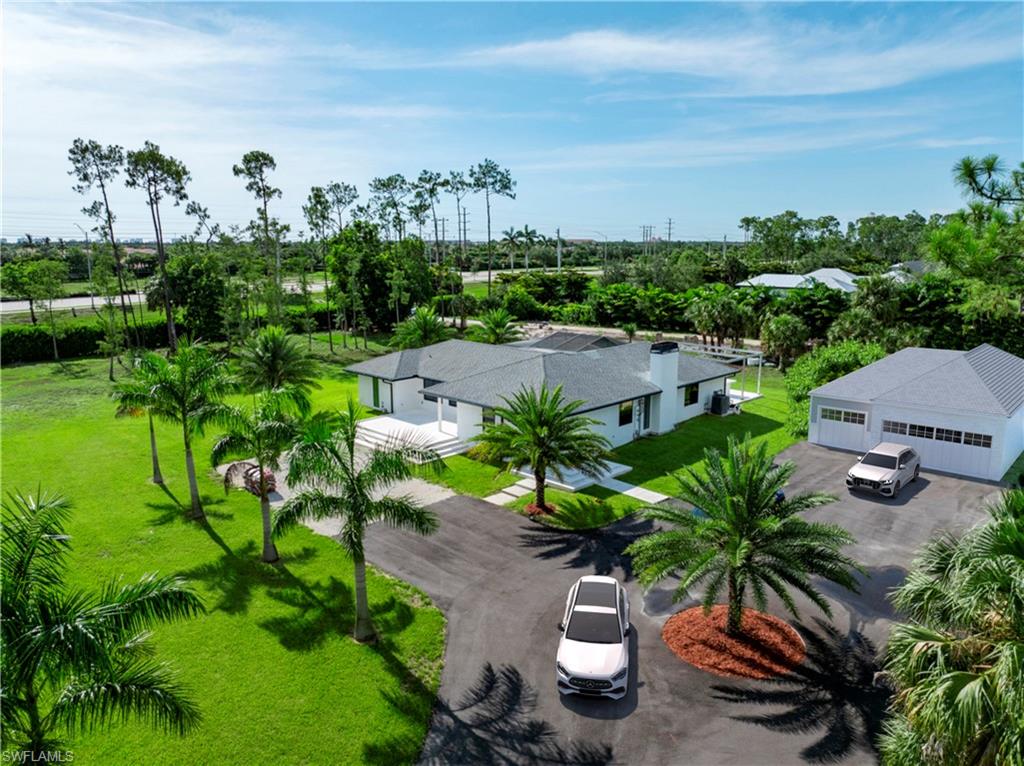 Bird's eye view of home with virtually rendered garage