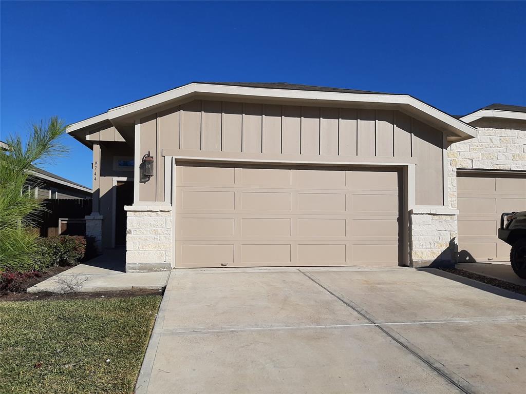 a view of backyard with garage