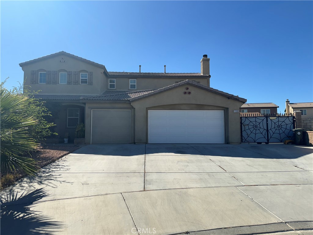 a front view of a house with a garage