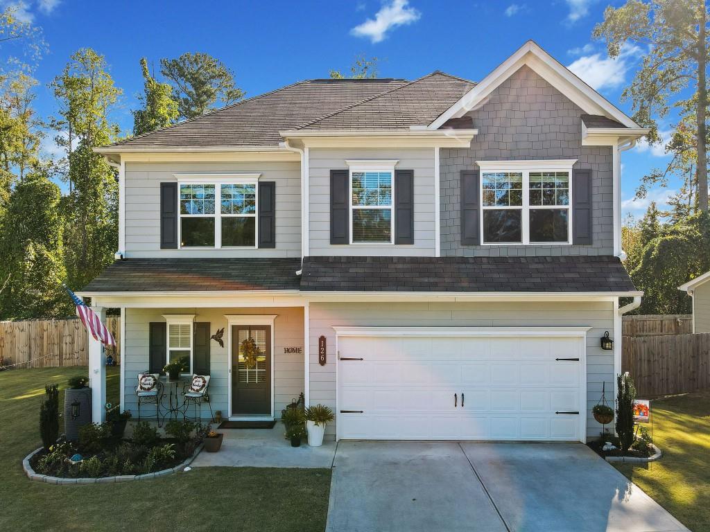 front view of a house with a yard