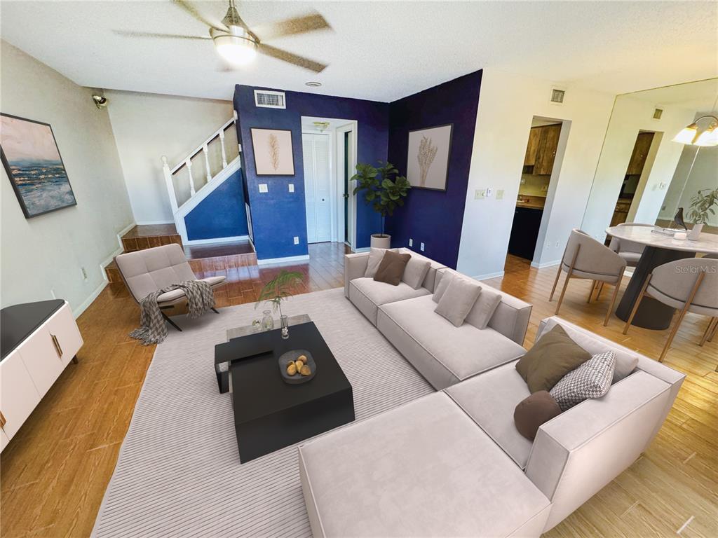 a living room with furniture and a flat screen tv