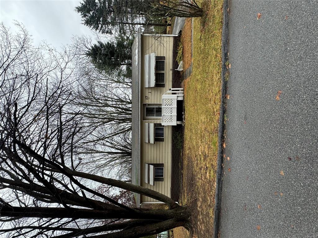 View of front of house with a front lawn