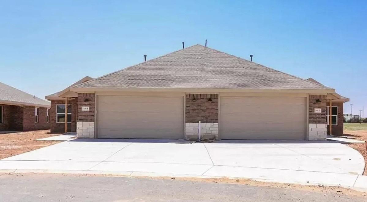 a front view of a house with a garage