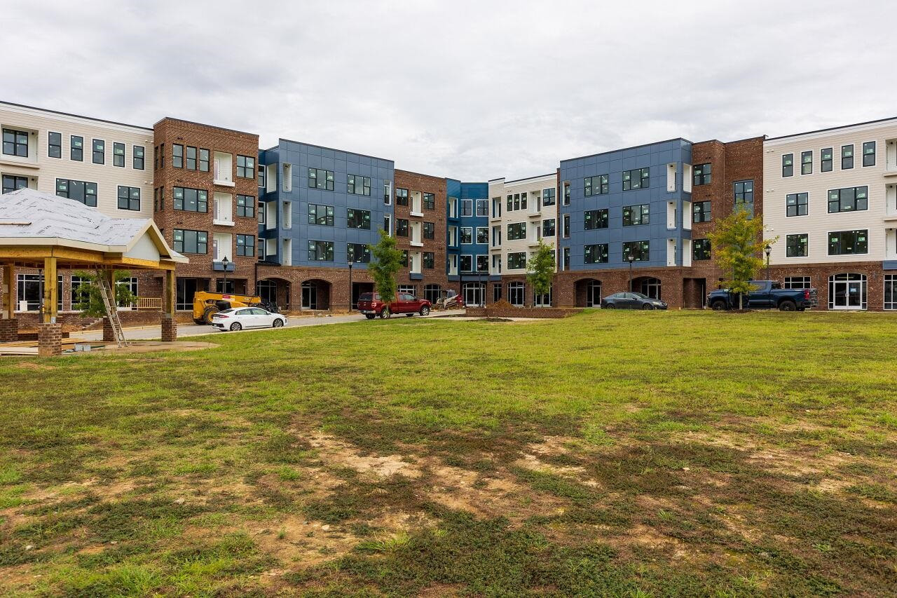 a view of a building with a yard