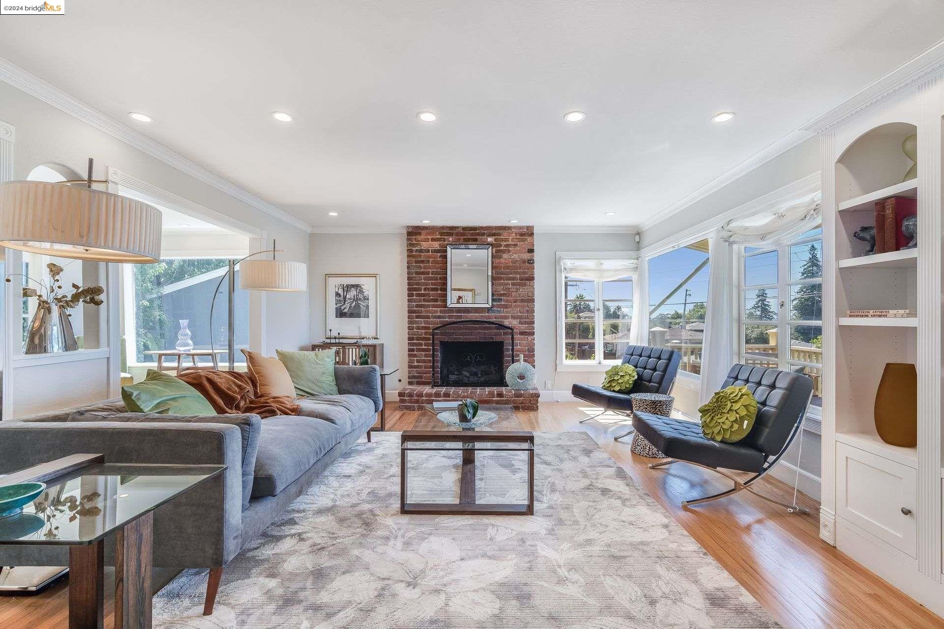 a living room with furniture a rug and a fireplace