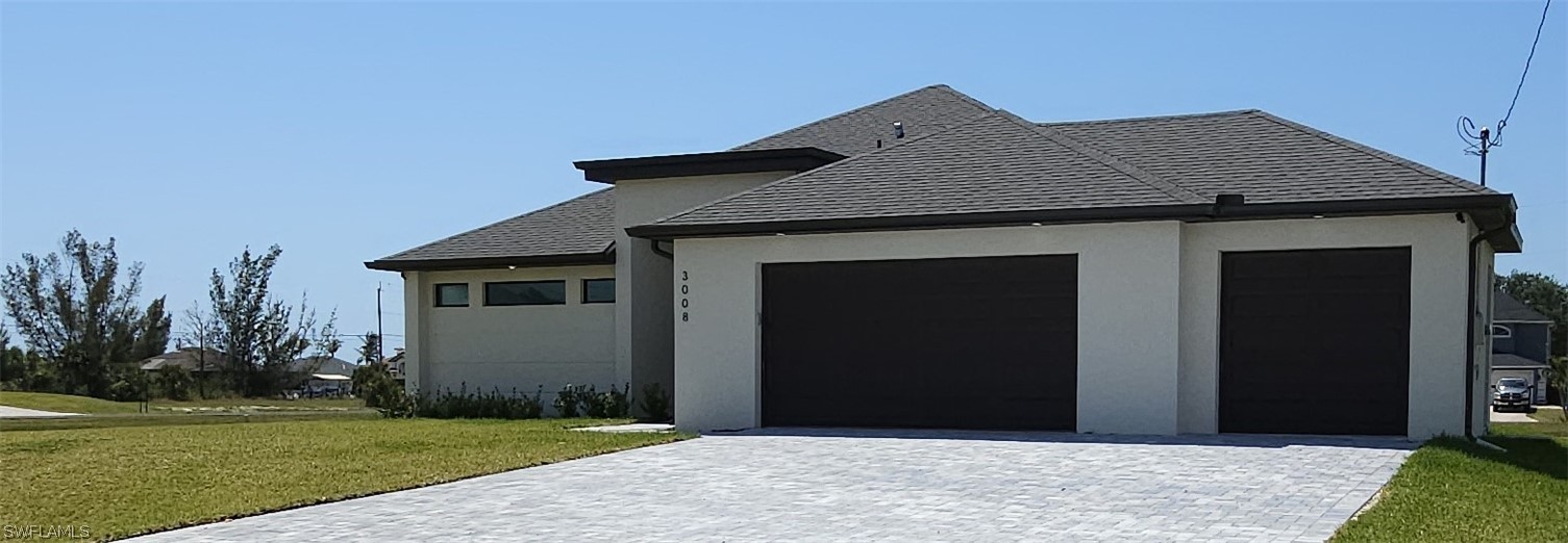 a front view of a house with a yard