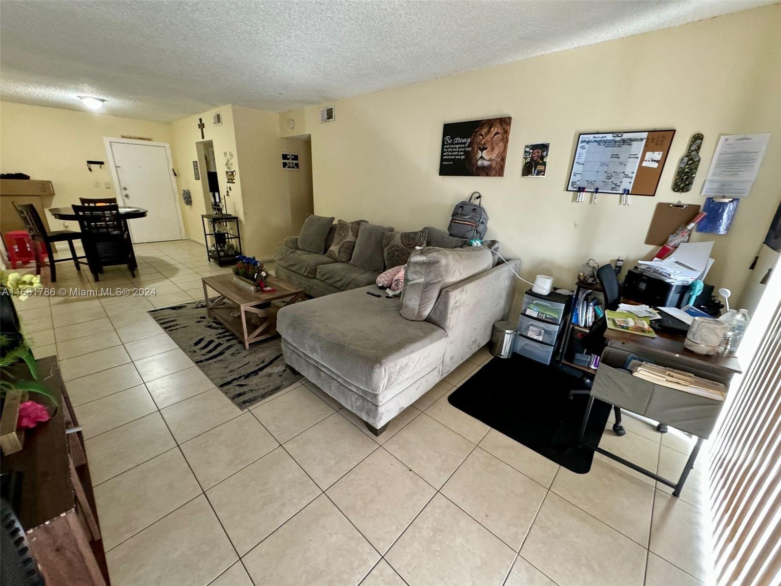 a living room with furniture and a couch