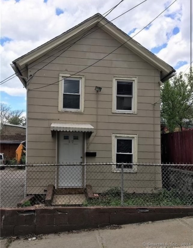 a front view of a house with garage