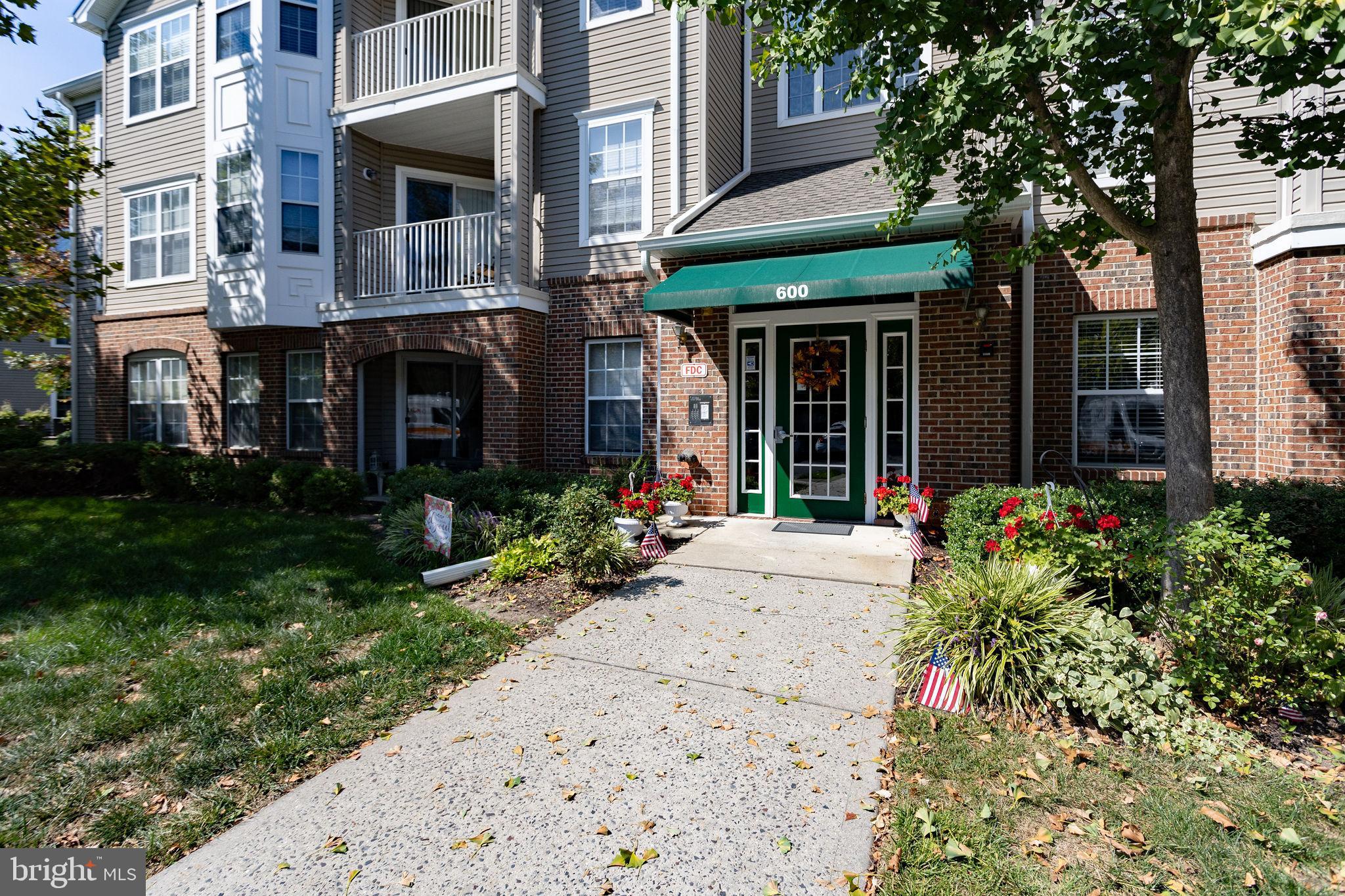 a view of a building with a yard