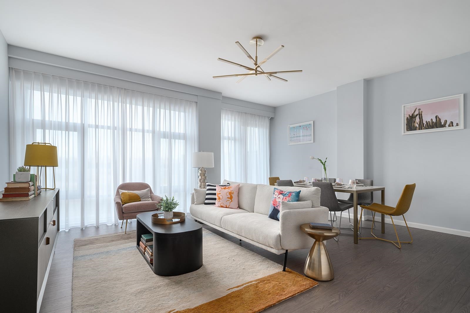 a living room with furniture and a window