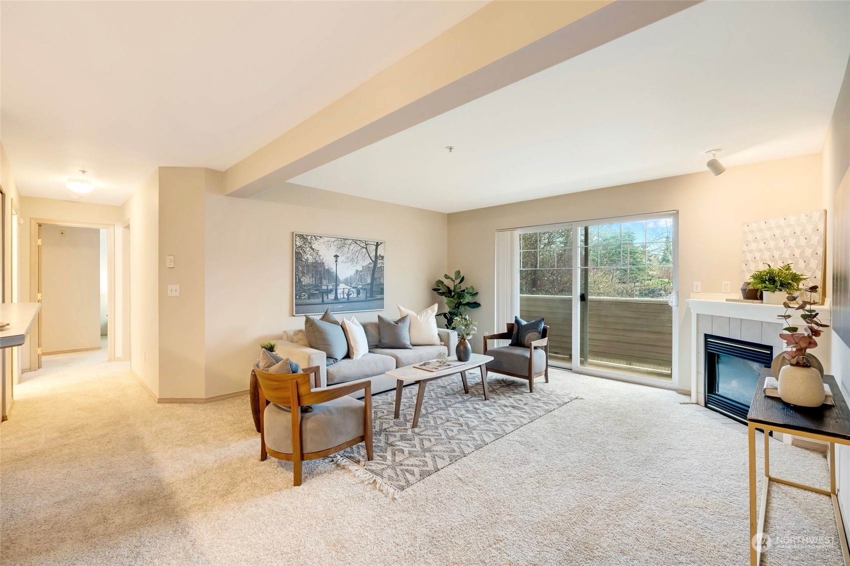 a living room with furniture and a fireplace