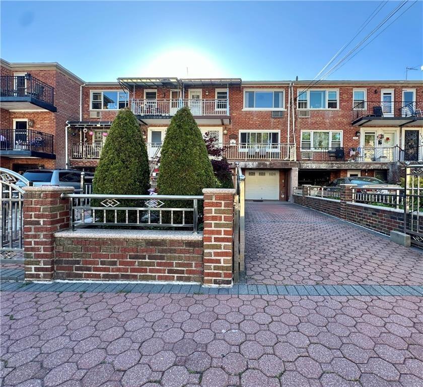 a view of a brick house with many windows