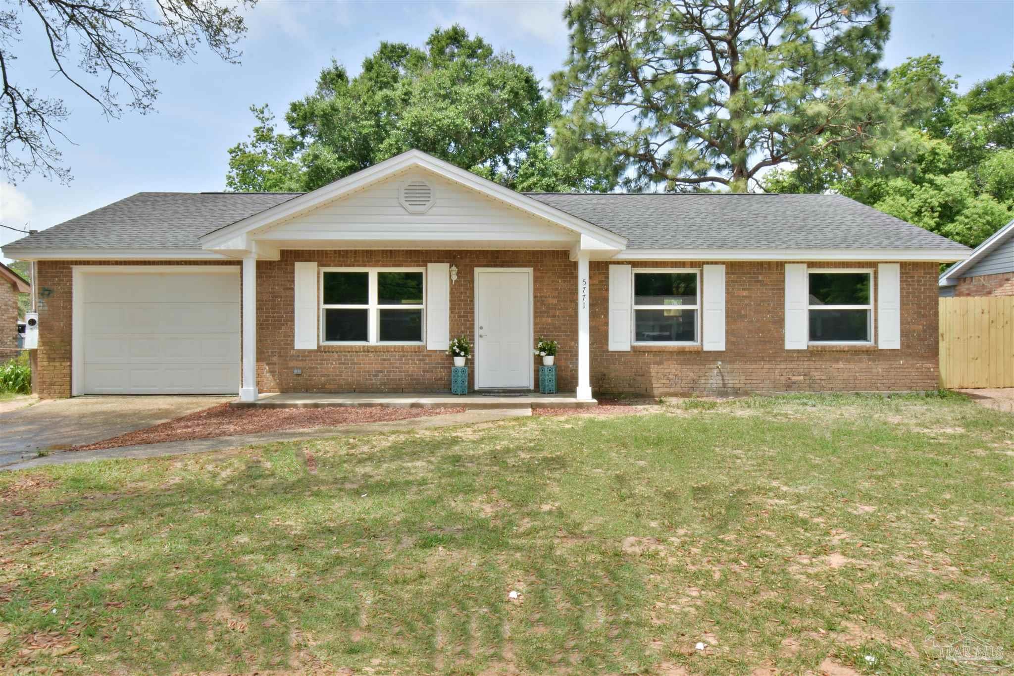 front view of a house and a yard